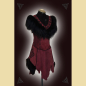 Preview: Dress made of burgundy suede. Decorated with lavish sheepskin trim, black trimmings, and black ornaments at the neckline and side panels. The skirt section shows the natural edges of the goat suede.
