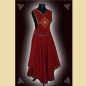 Preview: Kleid aus weinrotem Rindveloursleder und einem fließenden Textilgewebe. Das Kleid ist verziert mit einer aufwändigen, goldenen Stickerei in Form eines keltischen Kreuzes und einer mittelalterlichen Kassettenborte.