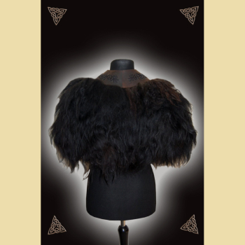 Fur cape made of black sheepskin, dark brown leather and wolf motif
