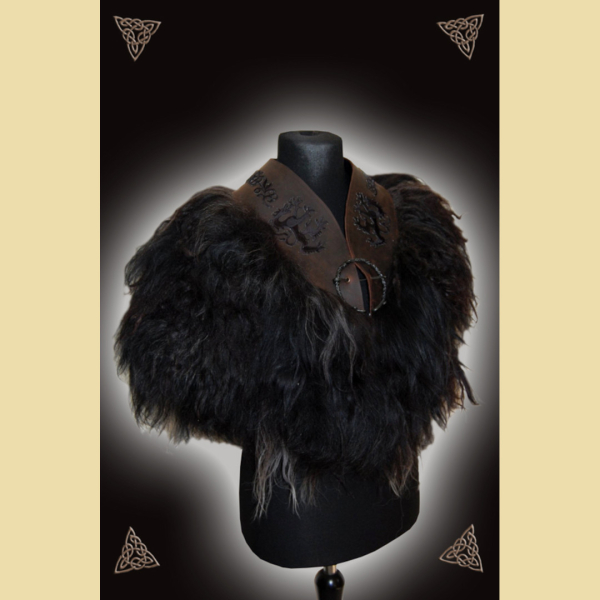 Fur cape made of black sheepskin, dark brown leather and wolf motif