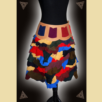 A hip-hugging skirt made of natural-colored oiled leather and colorful cowhide and goatskin suede.